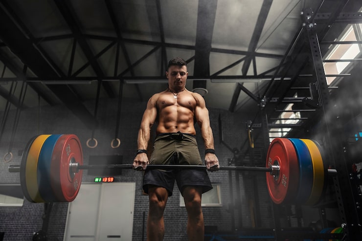 man holding a heavy barbell for perform deadlift